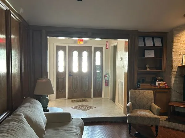 Welcoming home entry and living area with seating and natural light